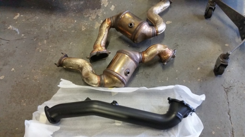 Original front pipes compared to new Milltek